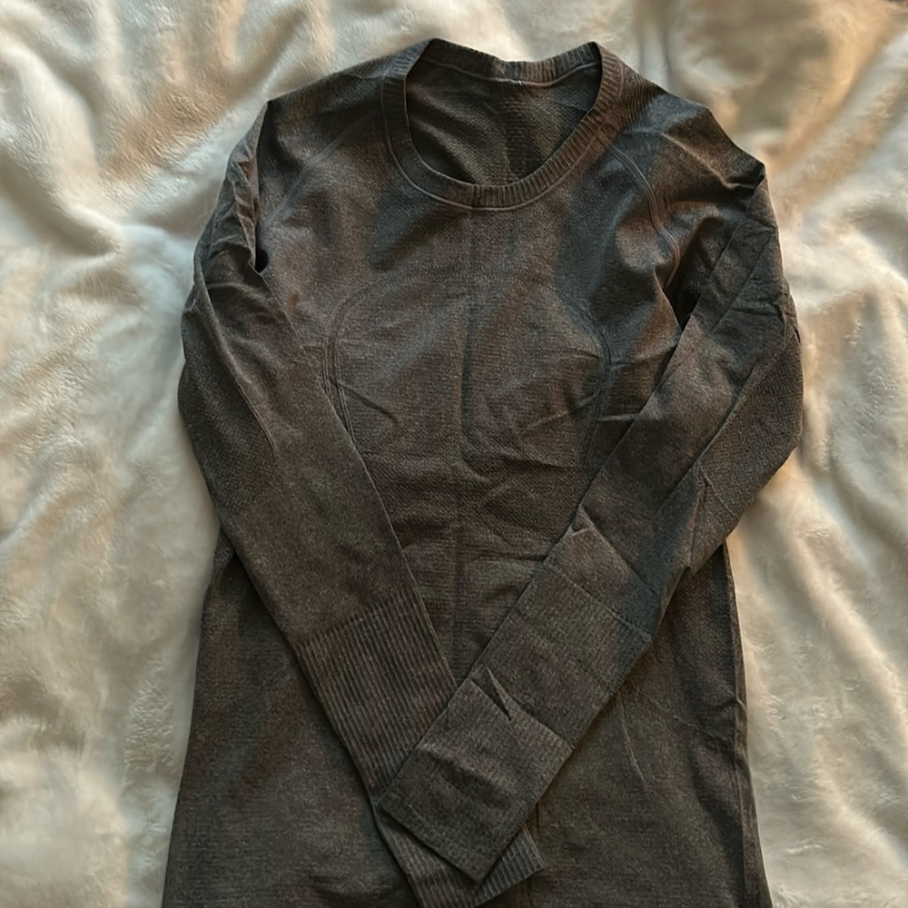 Lululemon grey long sleeve swiftly shirt. Women’s size 8.